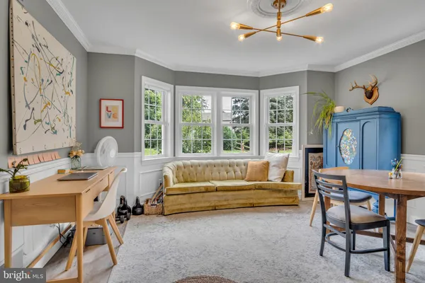 a kitchen that has a cabinets a sink and a refrigerator
