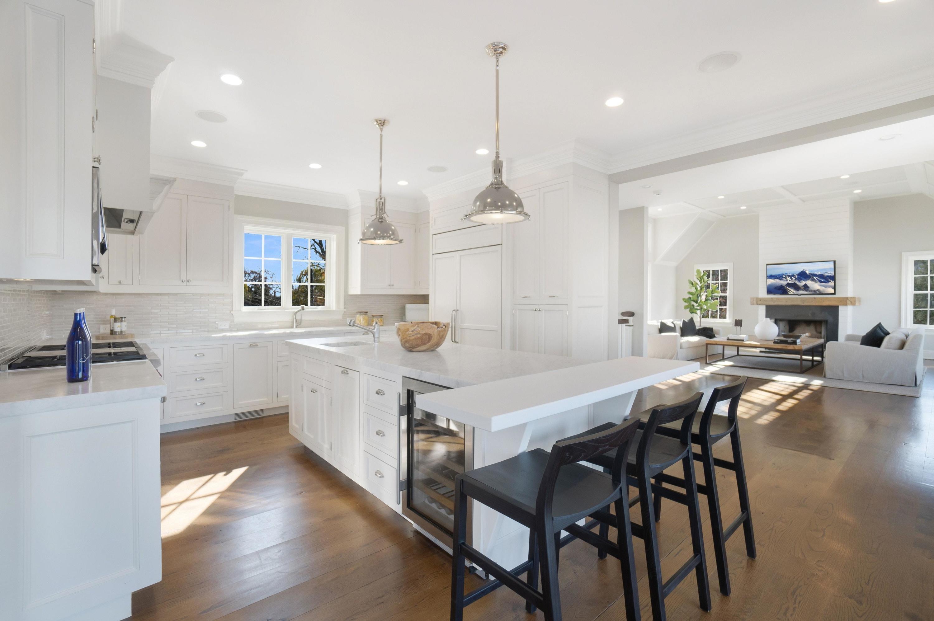5 N Road Darien, CT 06820 - Photo 11 of 38 a kitchen with a table chairs sink and cabinets