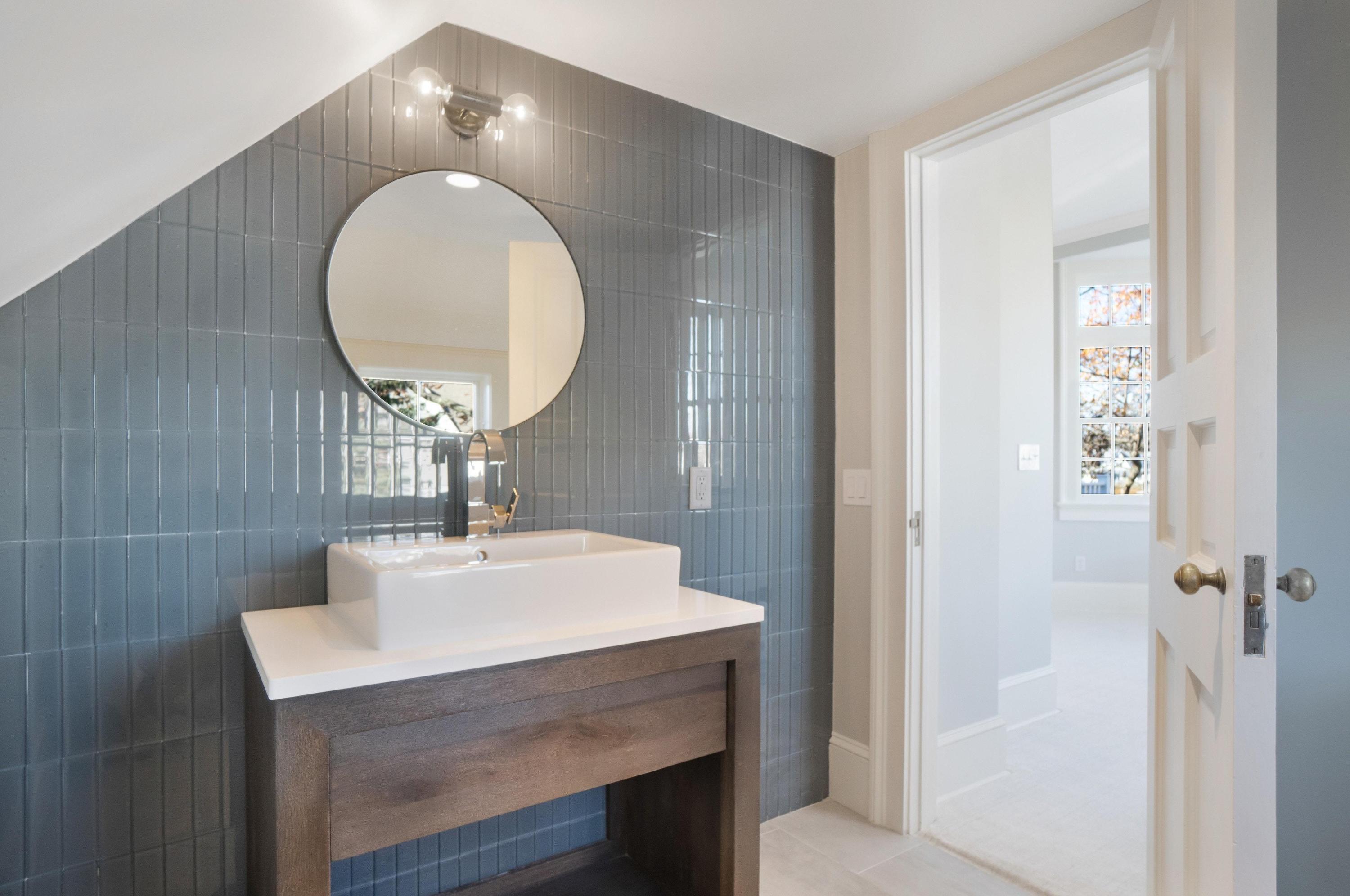 5 N Road Darien, CT 06820 - Photo 20 of 38 a bathroom with a sink a mirror and a vanity
