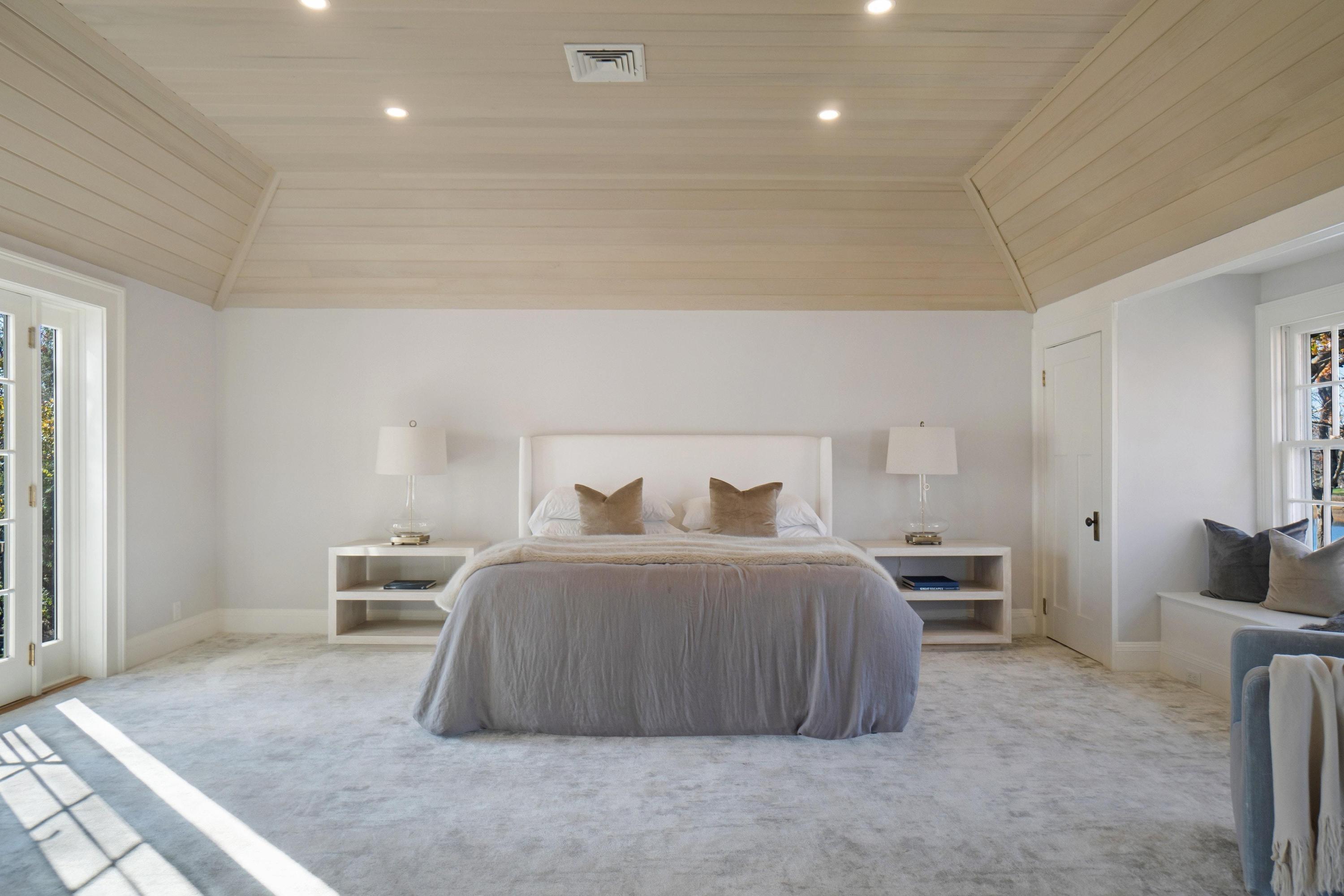 5 N Road Darien, CT 06820 - Photo 22 of 38 a bedroom with a bed and chair