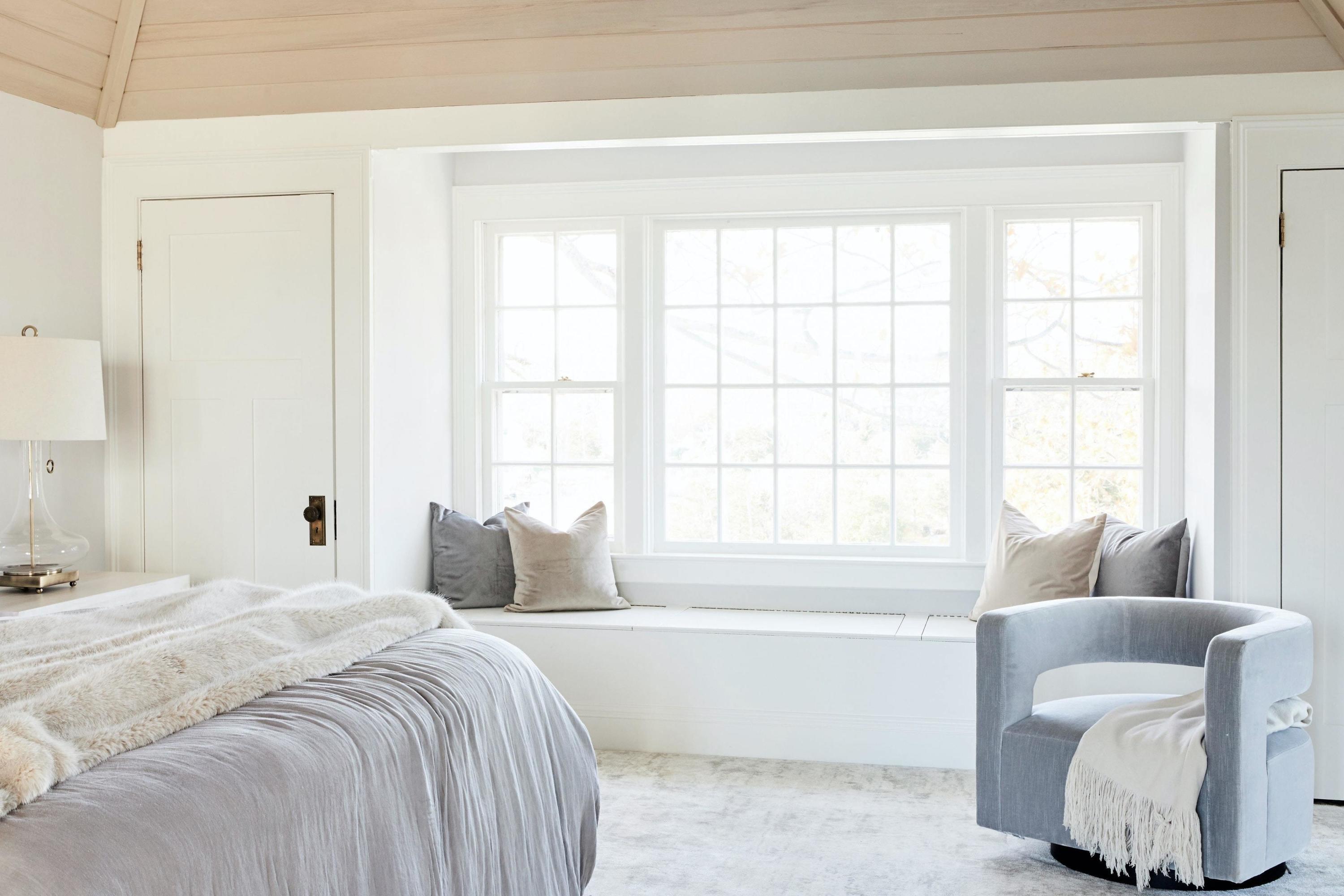 5 N Road Darien, CT 06820 - Photo 23 of 38 a bedroom with a bed and a couch with window