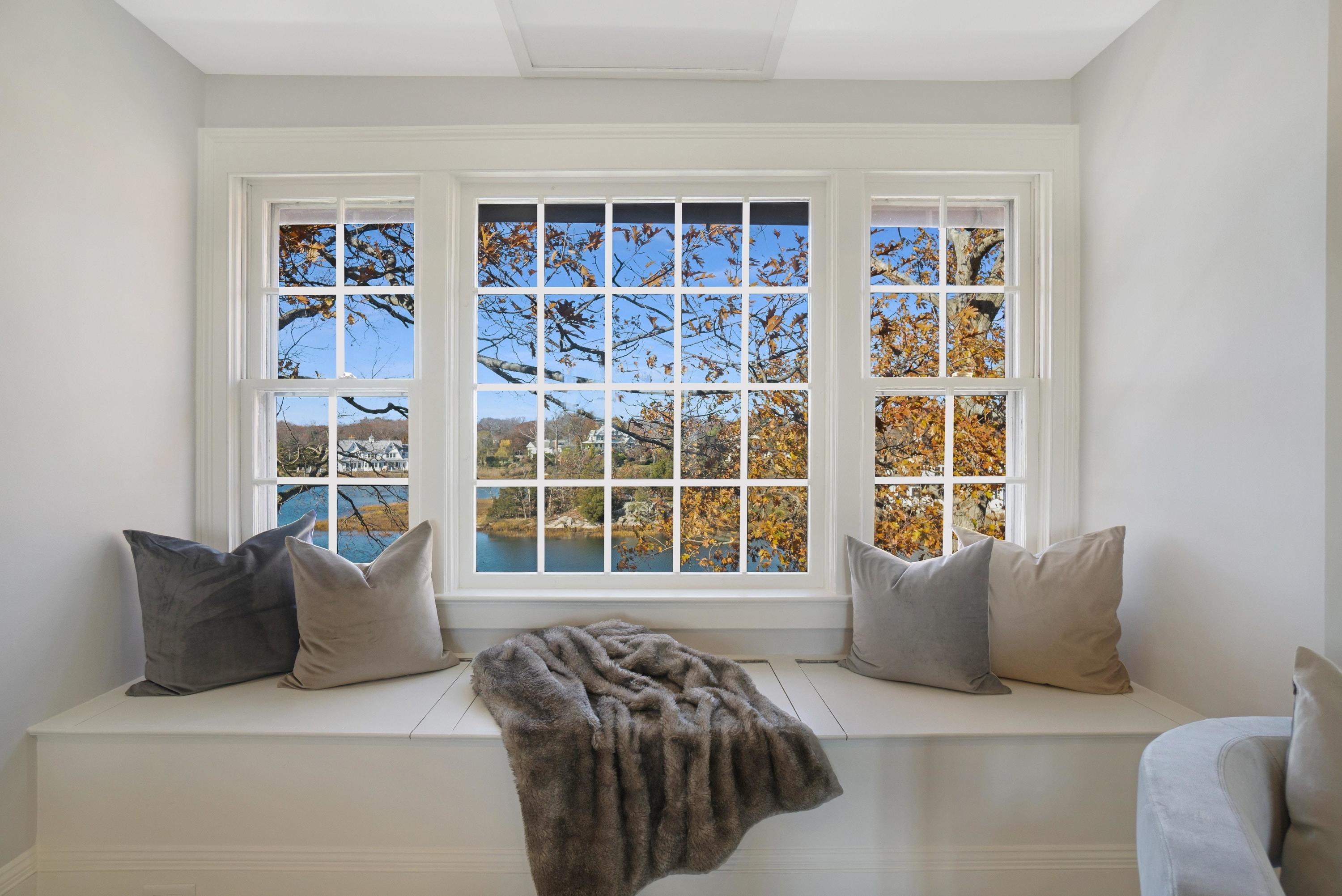 5 N Road Darien, CT 06820 - Photo 24 of 38 a bedroom with a bed and glass window