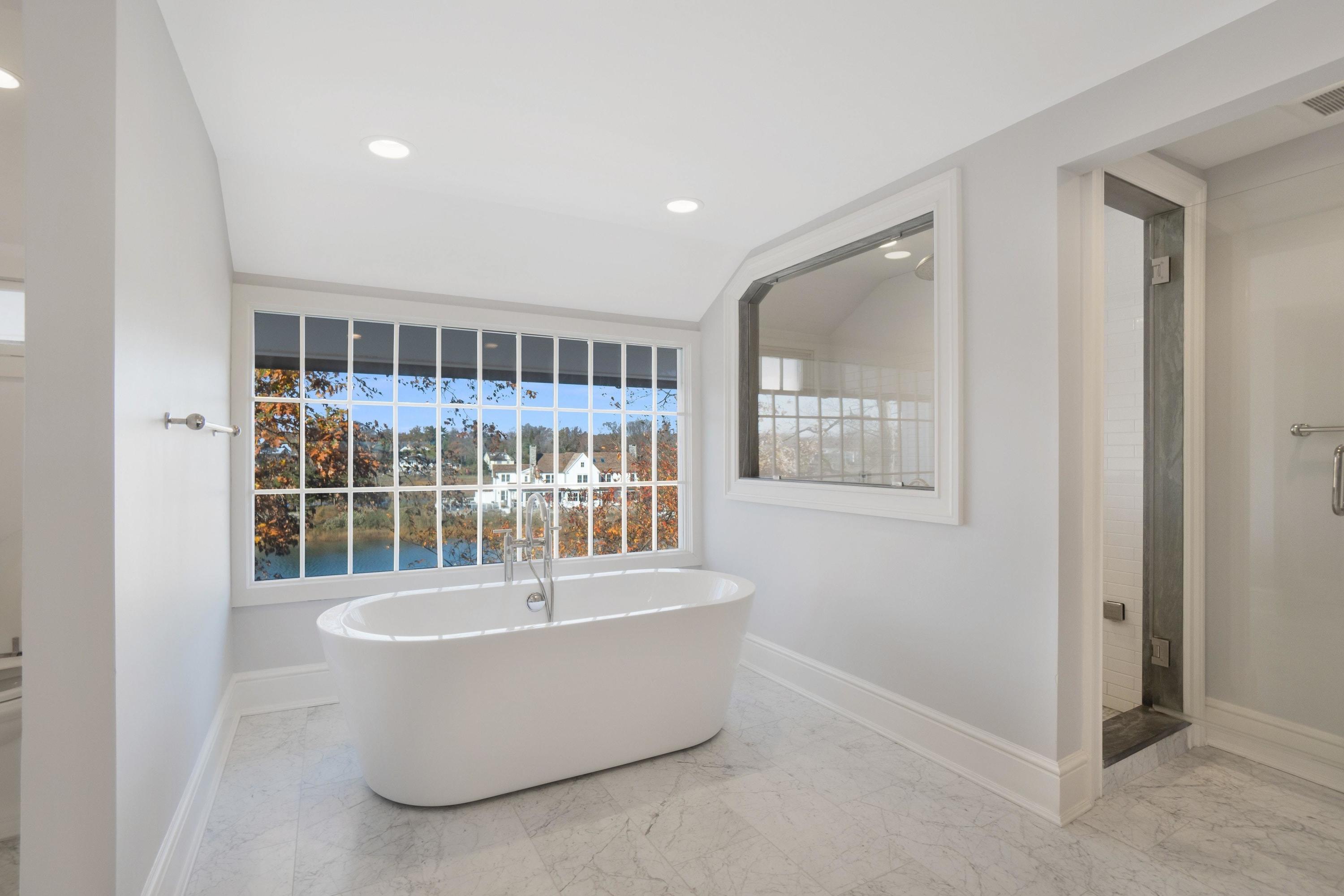 5 N Road Darien, CT 06820 - Photo 25 of 38 a living room with a couch and chandelier