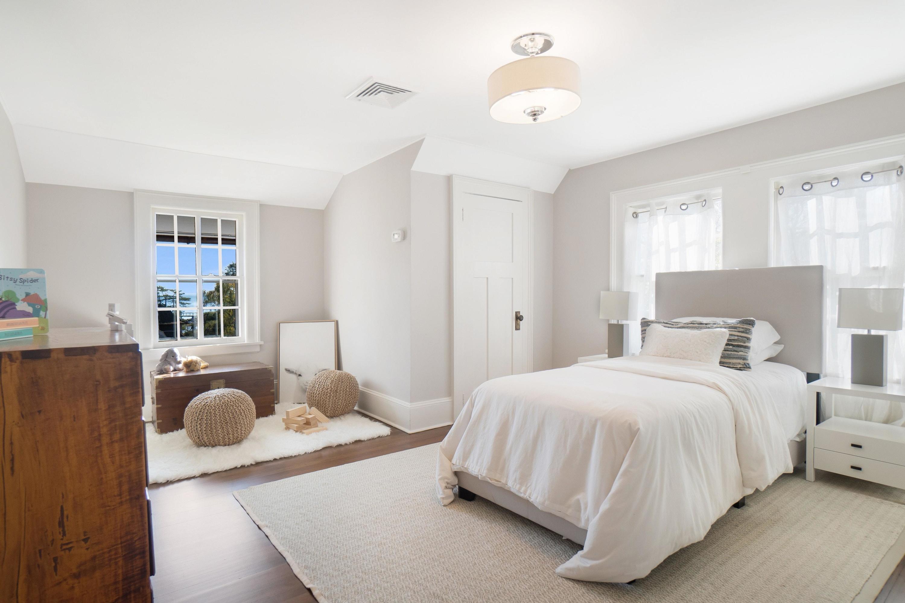 5 N Road Darien, CT 06820 - Photo 27 of 38 a bedroom with a bed and window