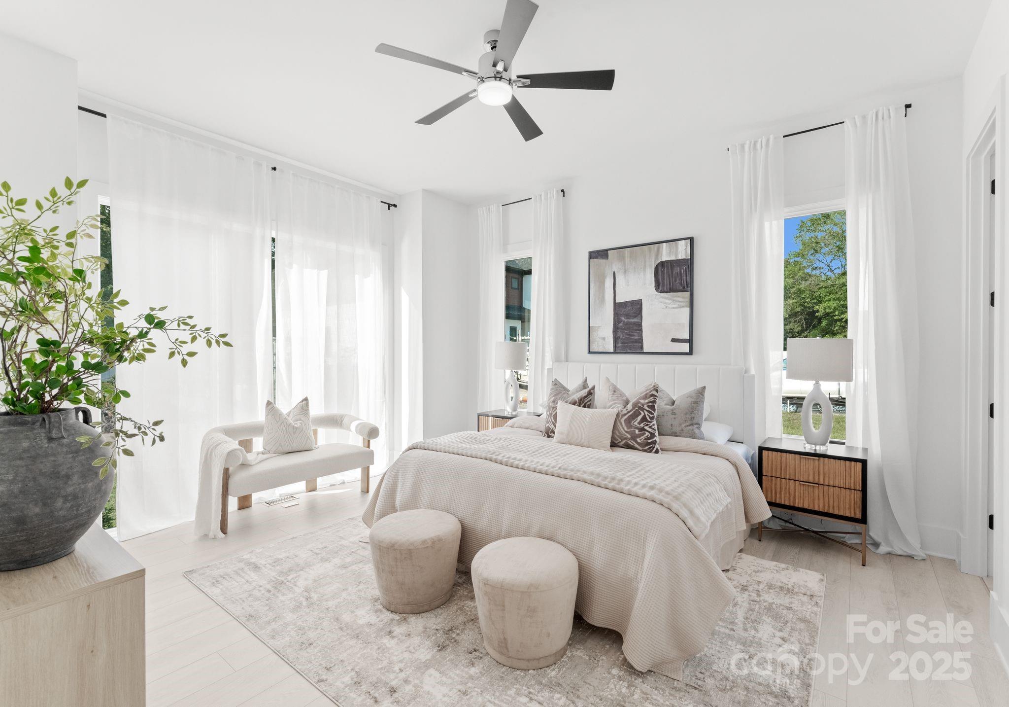 5428 Carmel Road Charlotte, NC 28226 - Photo 25 of 29 a bedroom with a bed potted plant and a window