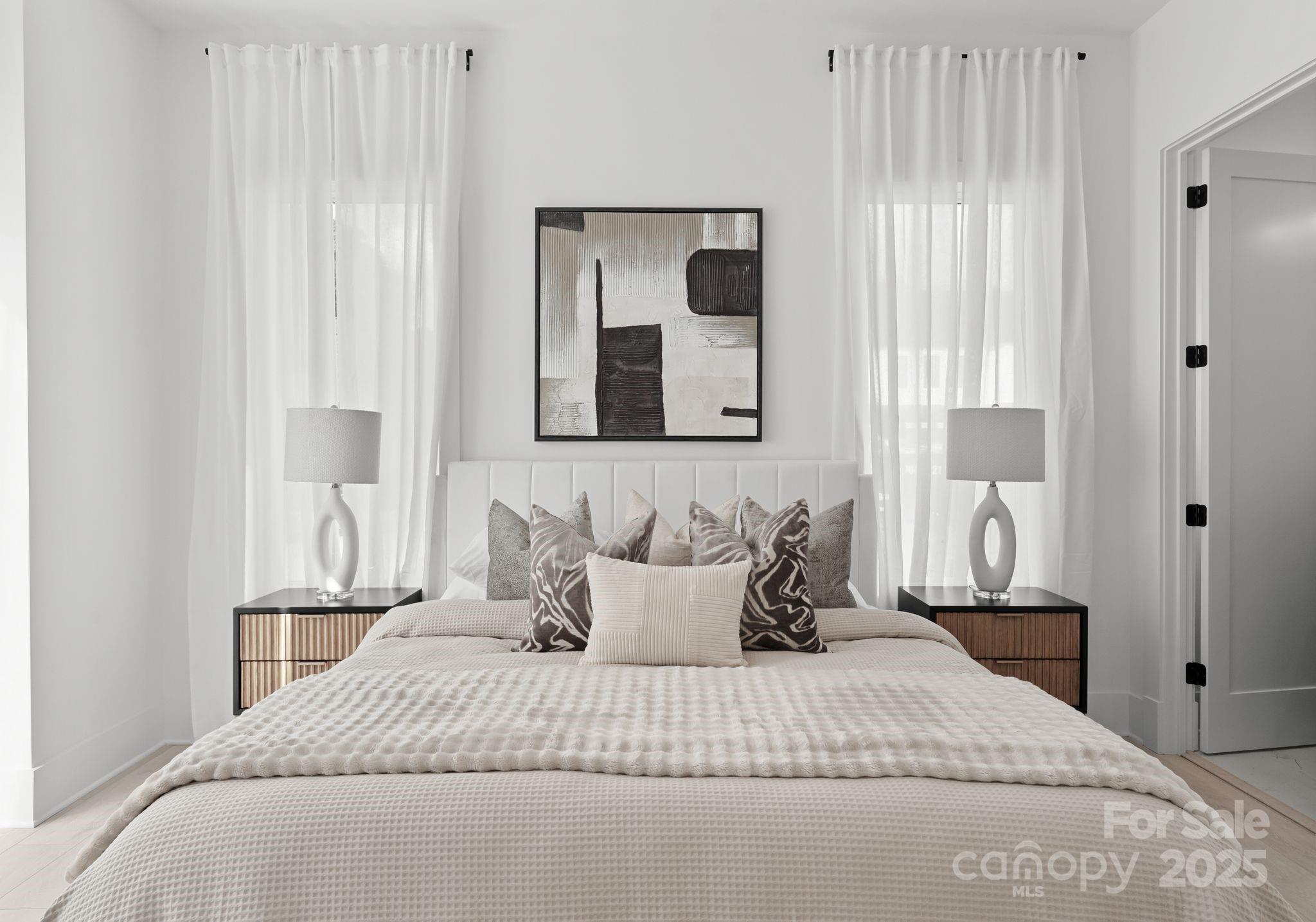 5428 Carmel Road Charlotte, NC 28226 - Photo 26 of 29 a bedroom with a bed and a mirror