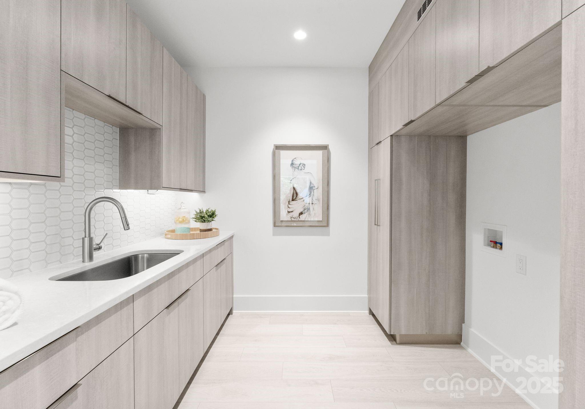 5428 Carmel Road Charlotte, NC 28226 - Photo 28 of 29 a view of a kitchen with a sink and dryer