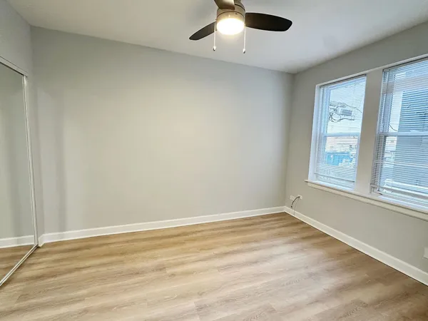 an empty room with a empty space and a window