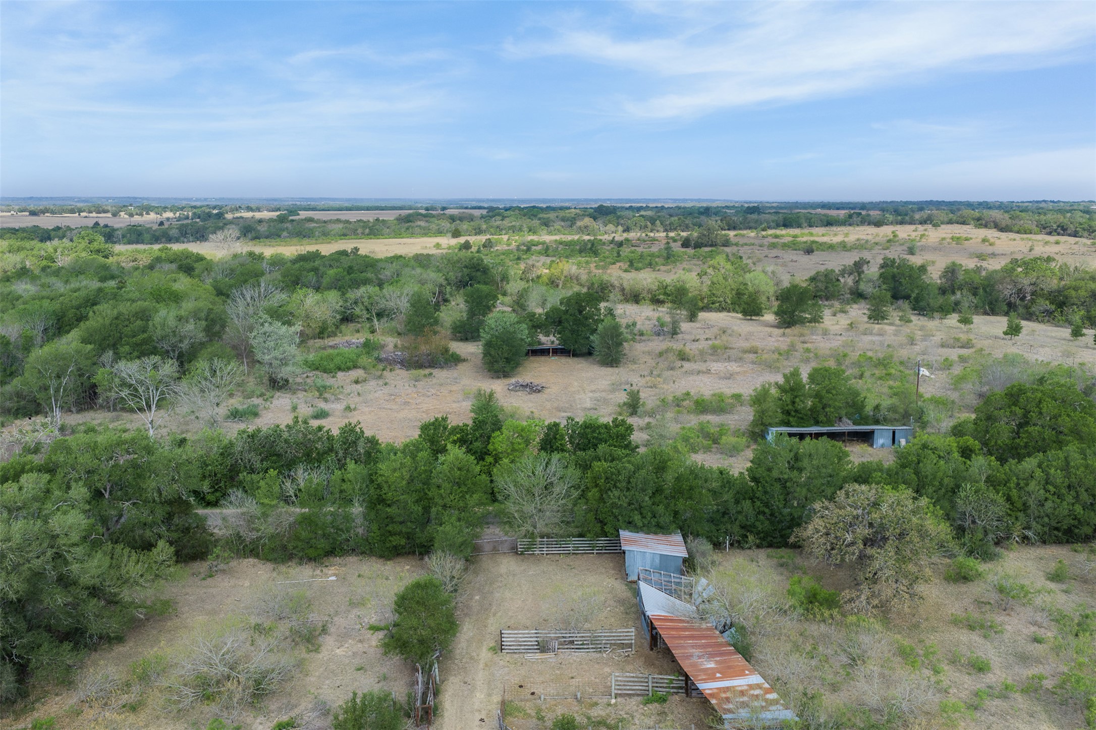 579 Lower Elgin Road Elgin, TX 78621 - Photo 38 of 40 an aerial view of a city with lots of residential buildings and mountain view in back