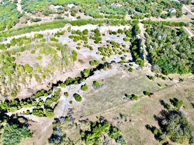 an aerial view of a yard and flowers