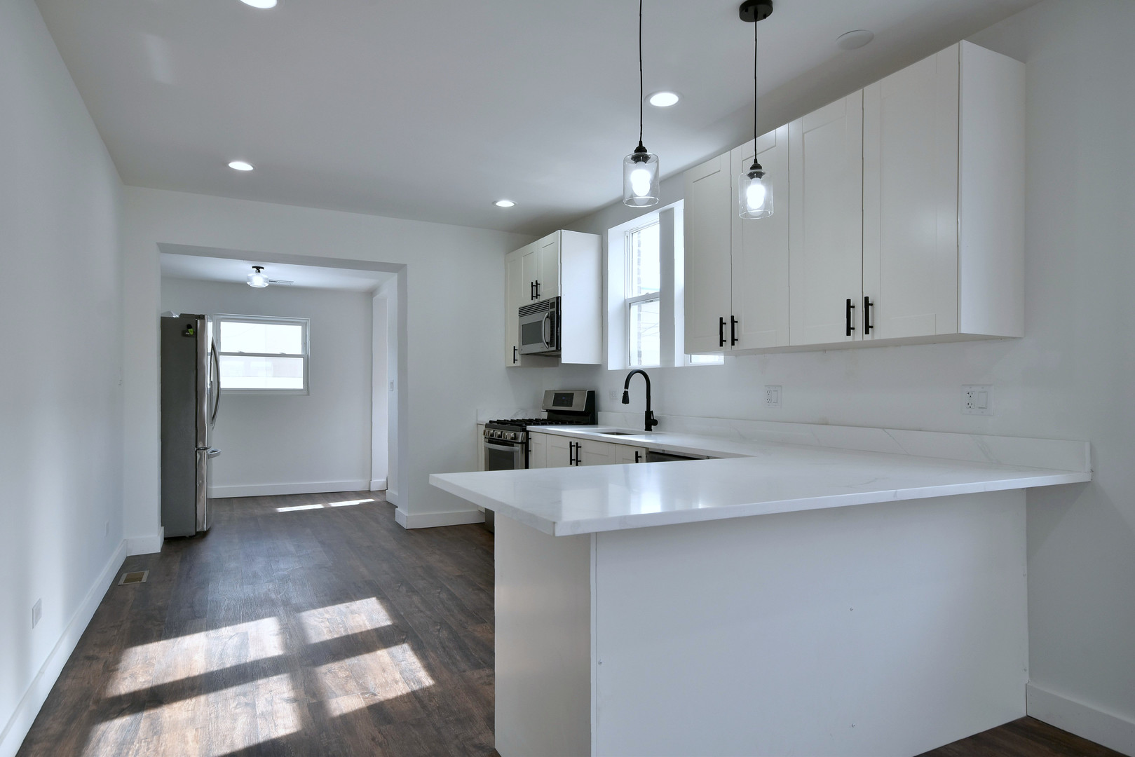 1405 South Central Avenue Cicero, IL 60804 - Photo 12 of 23 a view of a kitchen counter space a sink and dishwasher