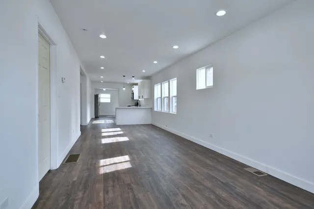 a view of entryway with wooden floor