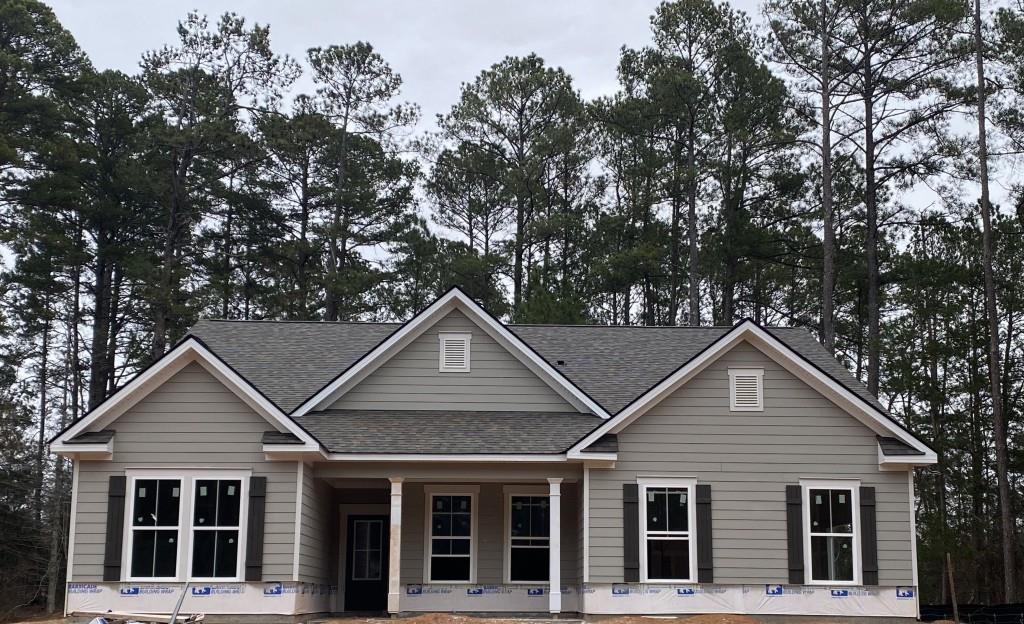 a front view of a house with a yard