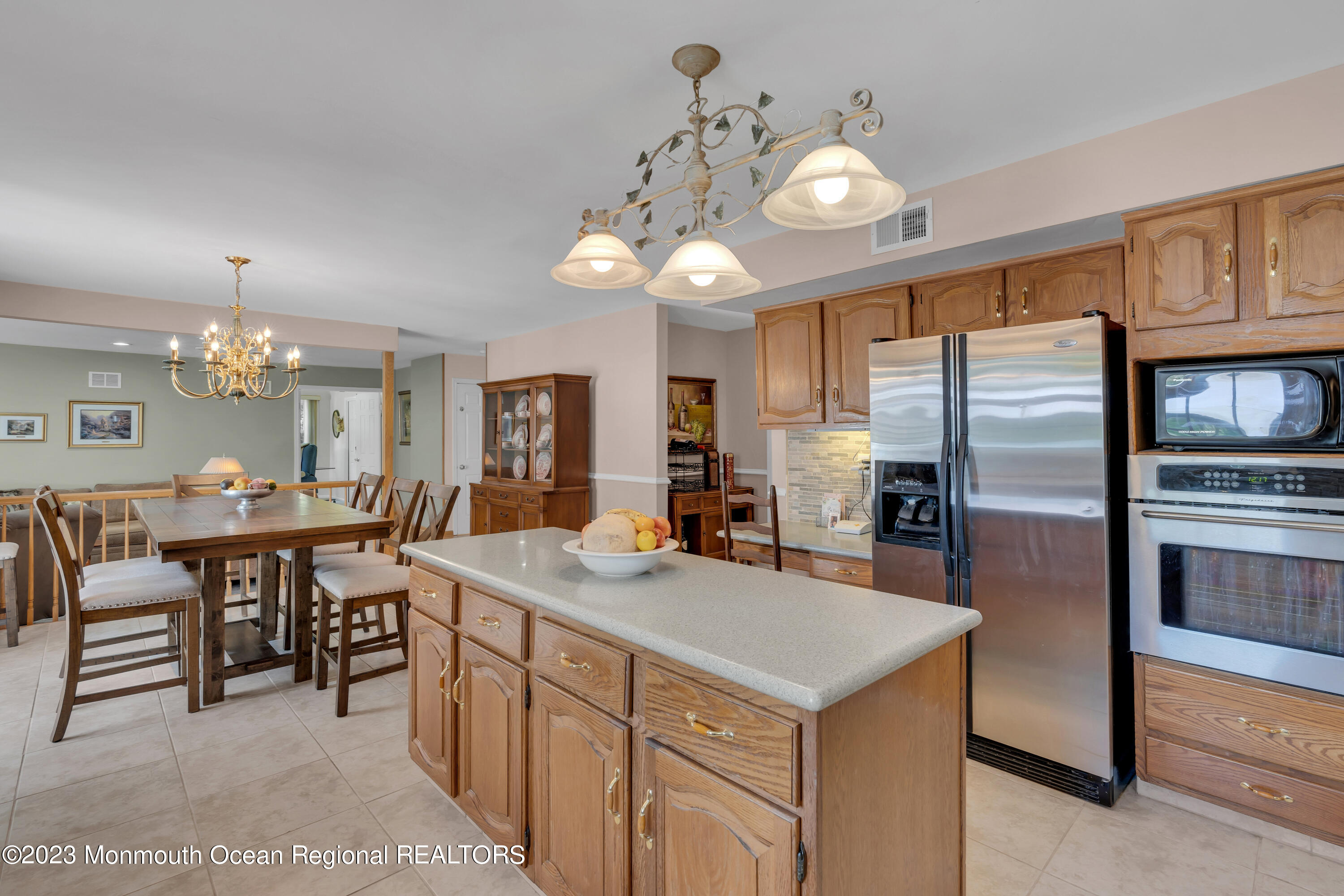 15 Old Scots Road Marlboro, NJ 07746 - Photo 13 of 59 a kitchen with kitchen island granite countertop a sink refrigerator and cabinets