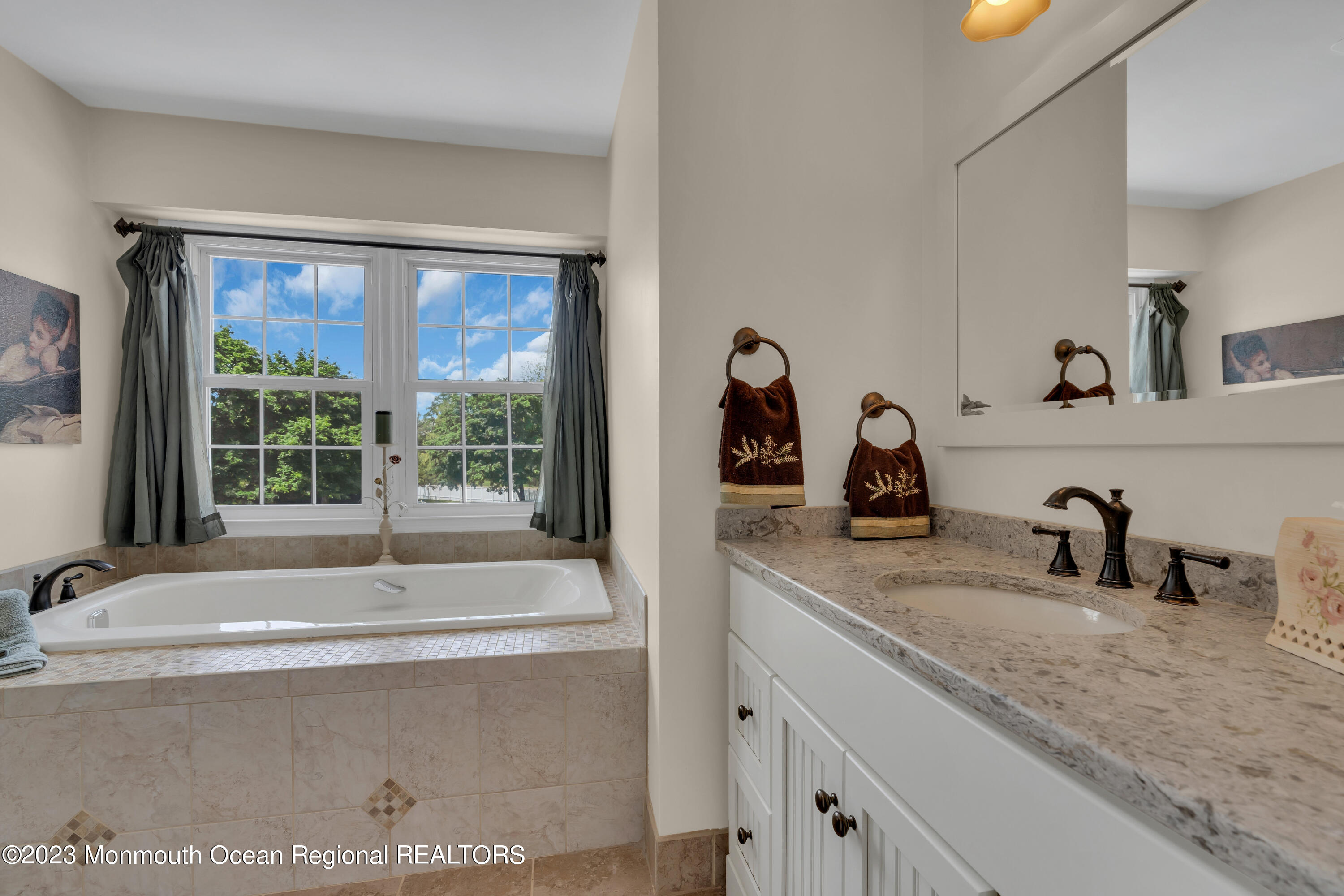 15 Old Scots Road Marlboro, NJ 07746 - Photo 22 of 59 a bathroom with a double vanity sink and mirror