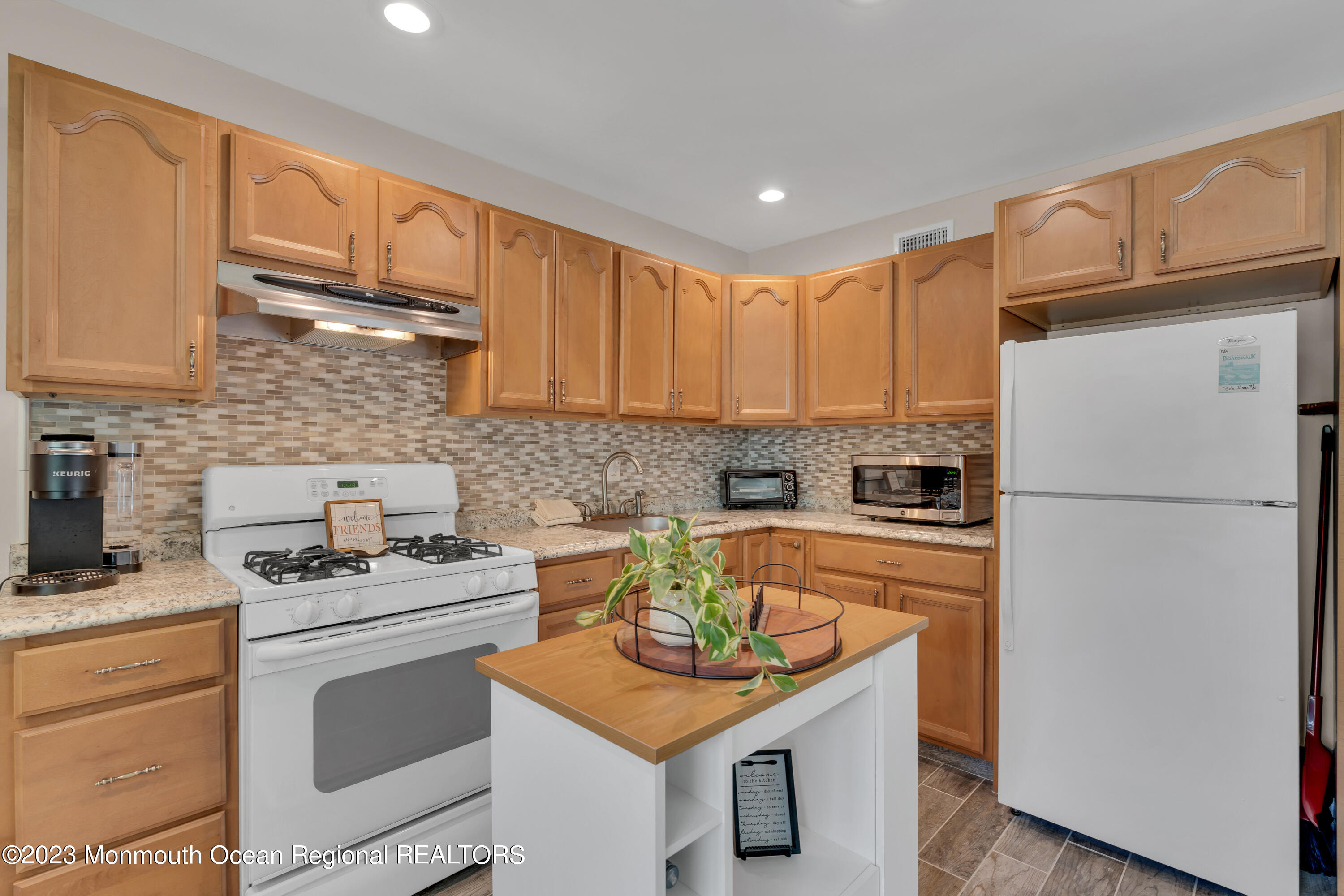 15 Old Scots Road Marlboro, NJ 07746 - Photo 30 of 59 a kitchen with stainless steel appliances granite countertop a sink stove refrigerator and cabinets