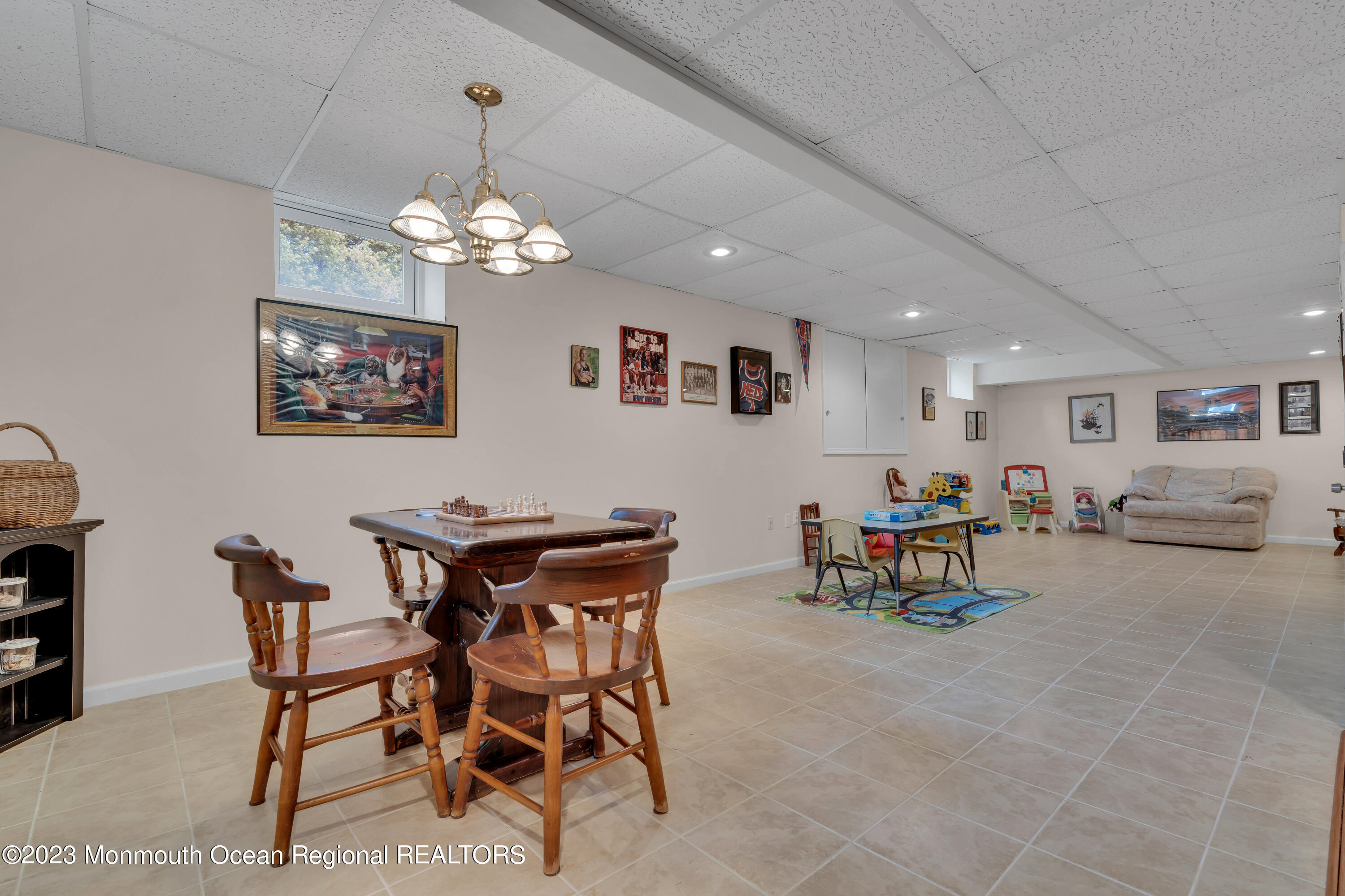 15 Old Scots Road Marlboro, NJ 07746 - Photo 38 of 59 a view of a dining room with furniture and a chandelier