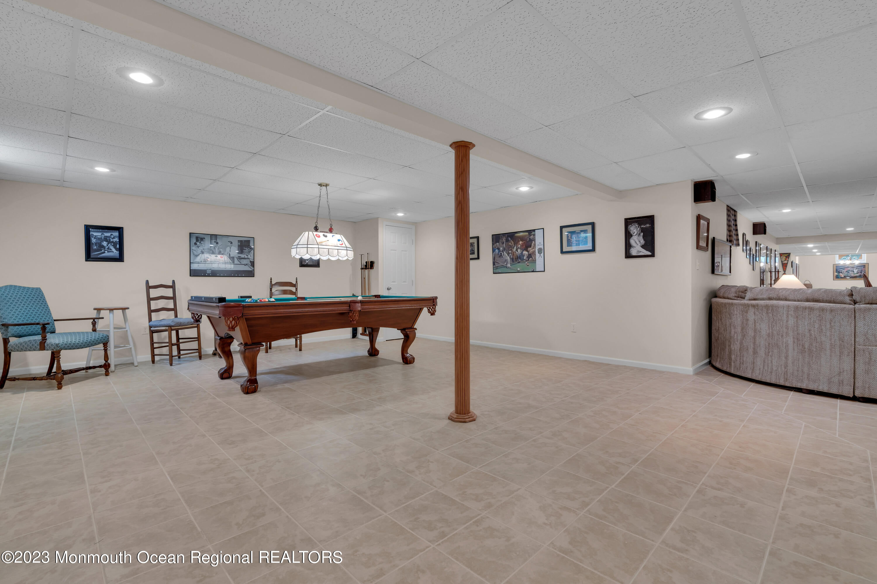 15 Old Scots Road Marlboro, NJ 07746 - Photo 44 of 59 a living room with furniture and a chandelier