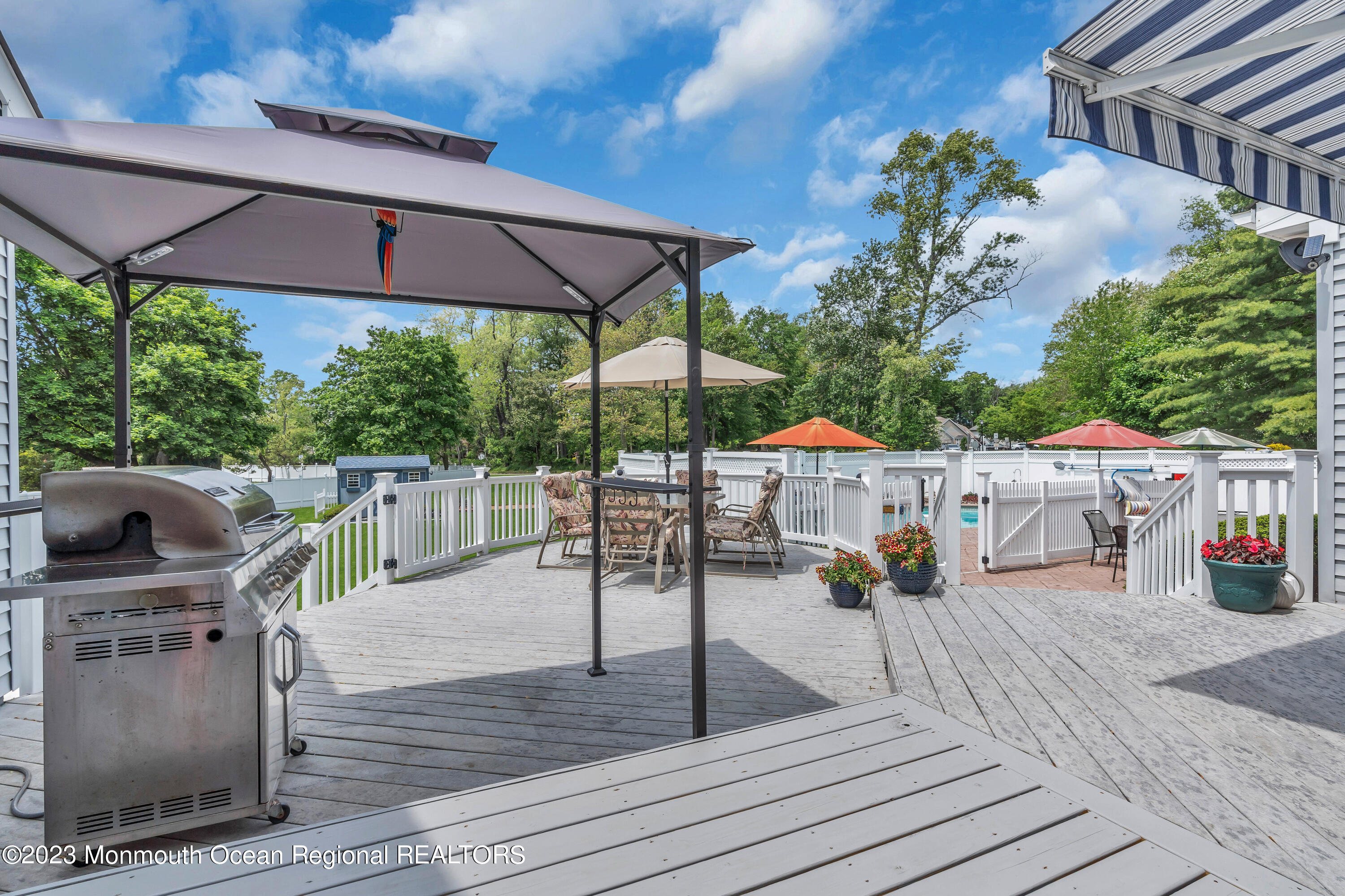 15 Old Scots Road Marlboro, NJ 07746 - Photo 47 of 59 a view of a patio with wooden floor and iron fence