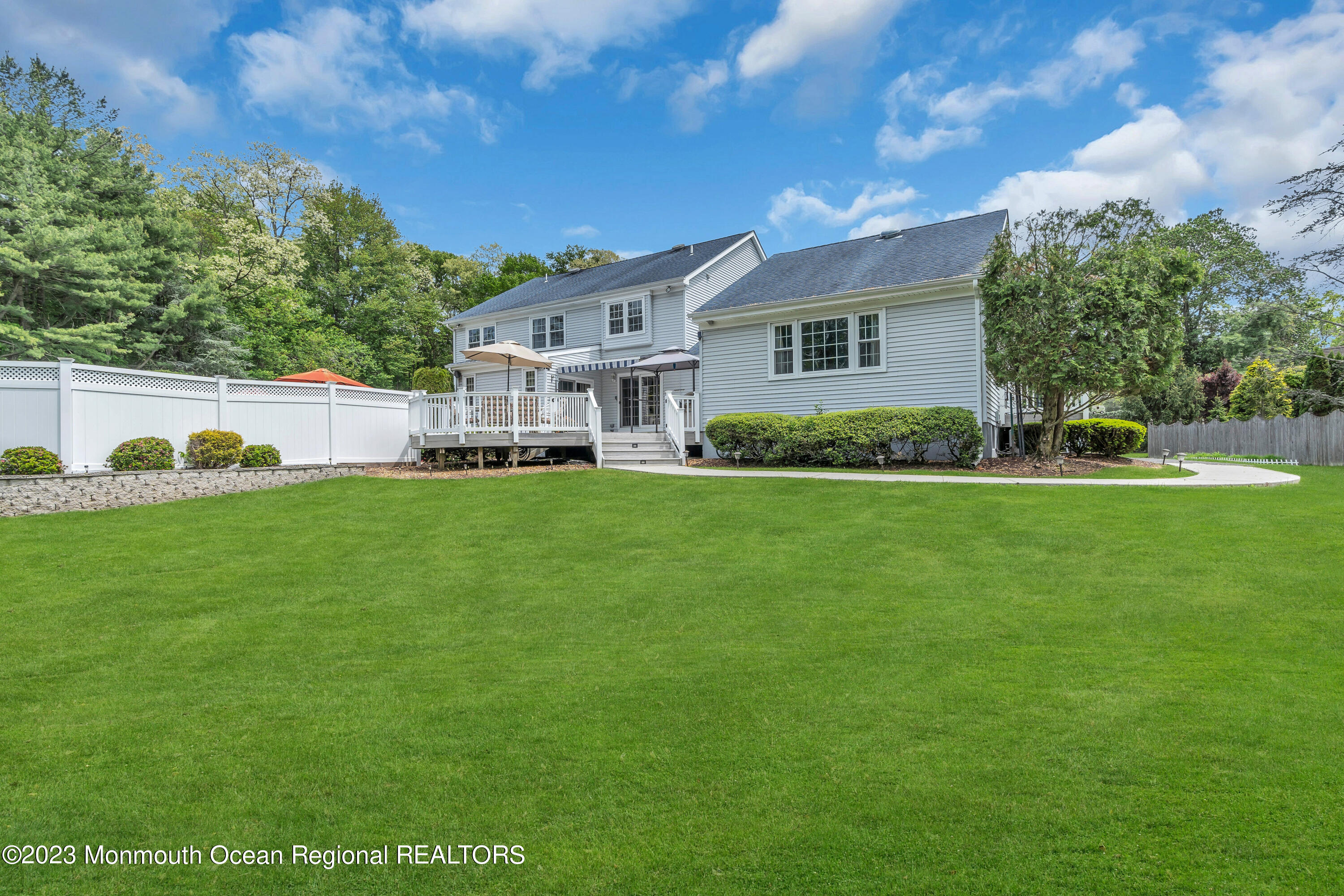 15 Old Scots Road Marlboro, NJ 07746 - Photo 56 of 59 a front view of a house with a yard