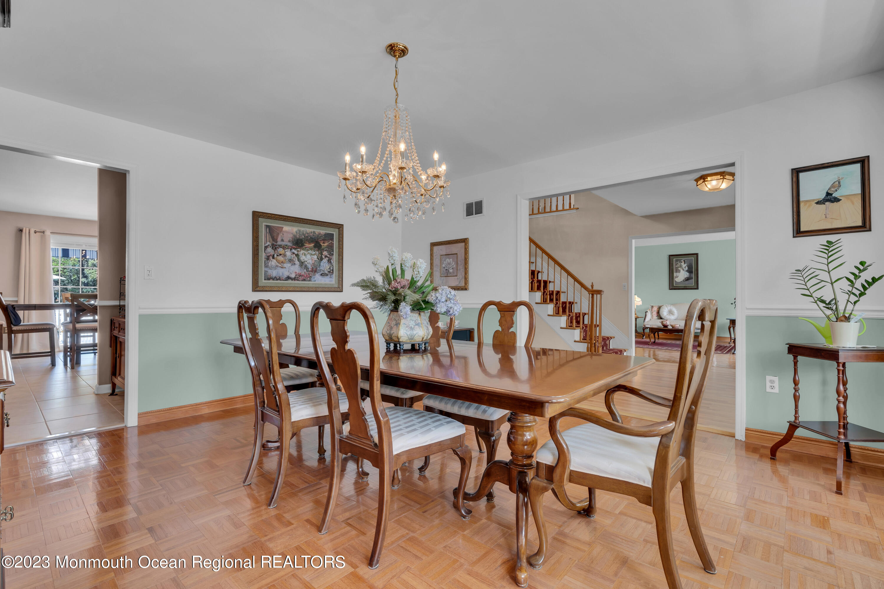 15 Old Scots Road Marlboro, NJ 07746 - Photo 9 of 59 a view of a dining room with furniture and chandelier