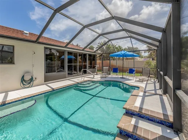 a dining room with furniture water view and a large window