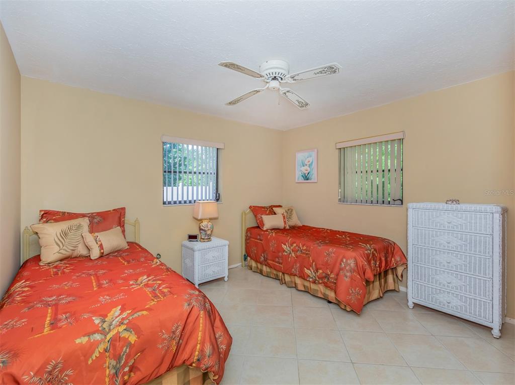 1211 Southland Road Venice, FL 34293 - Photo 35 of 80 a bedroom with a bed and window