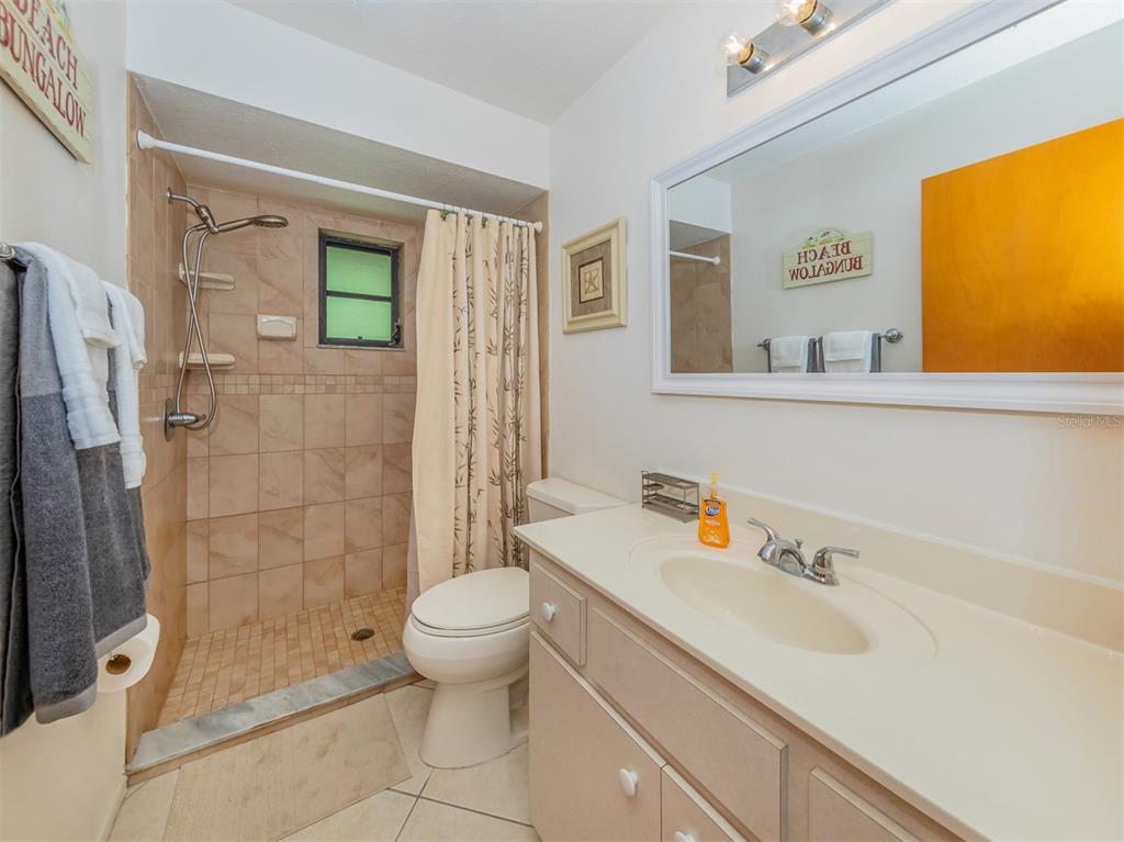 1211 Southland Road Venice, FL 34293 - Photo 36 of 80 a bathroom with a sink toilet and shower
