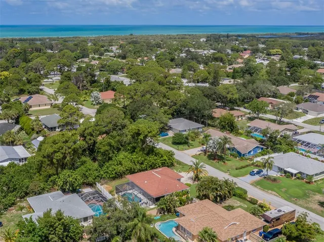 a view of a swimming pool with a garden and plants