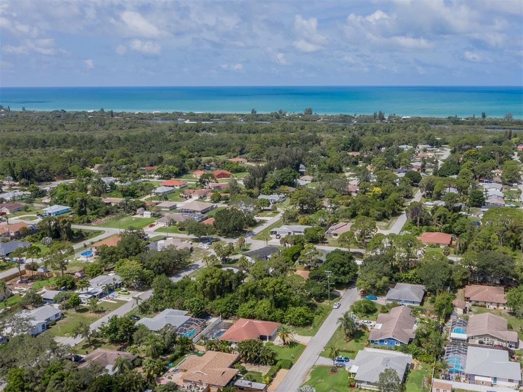 1211 Southland Road Venice, FL 34293 - Photo 39 of 80 an aerial view of residential houses with outdoor space and trees