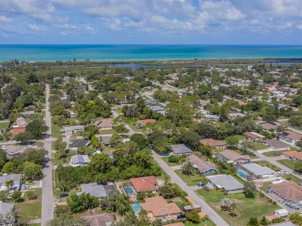 1211 Southland Road Venice, FL 34293 - Photo 40 of 80 an aerial view of residential houses with outdoor space