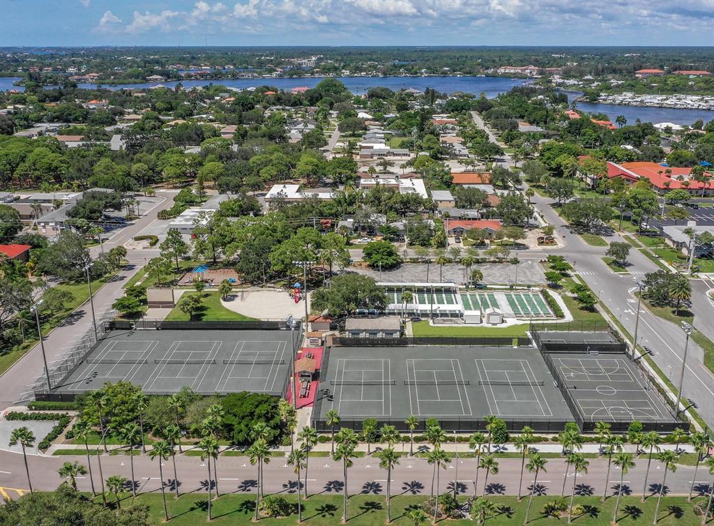 1211 Southland Road Venice, FL 34293 - Photo 67 of 80 an aerial view of residential houses with outdoor space and parking