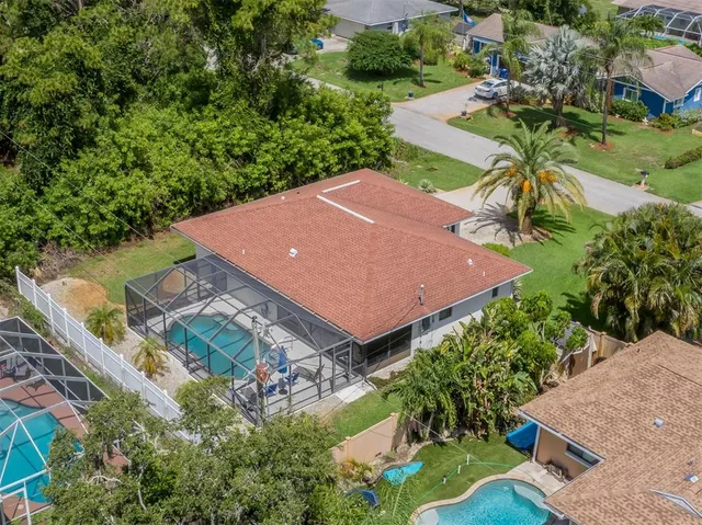 a view of a backyard with sitting area and furniture