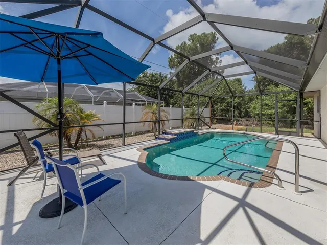 a patio with yard table and chairs
