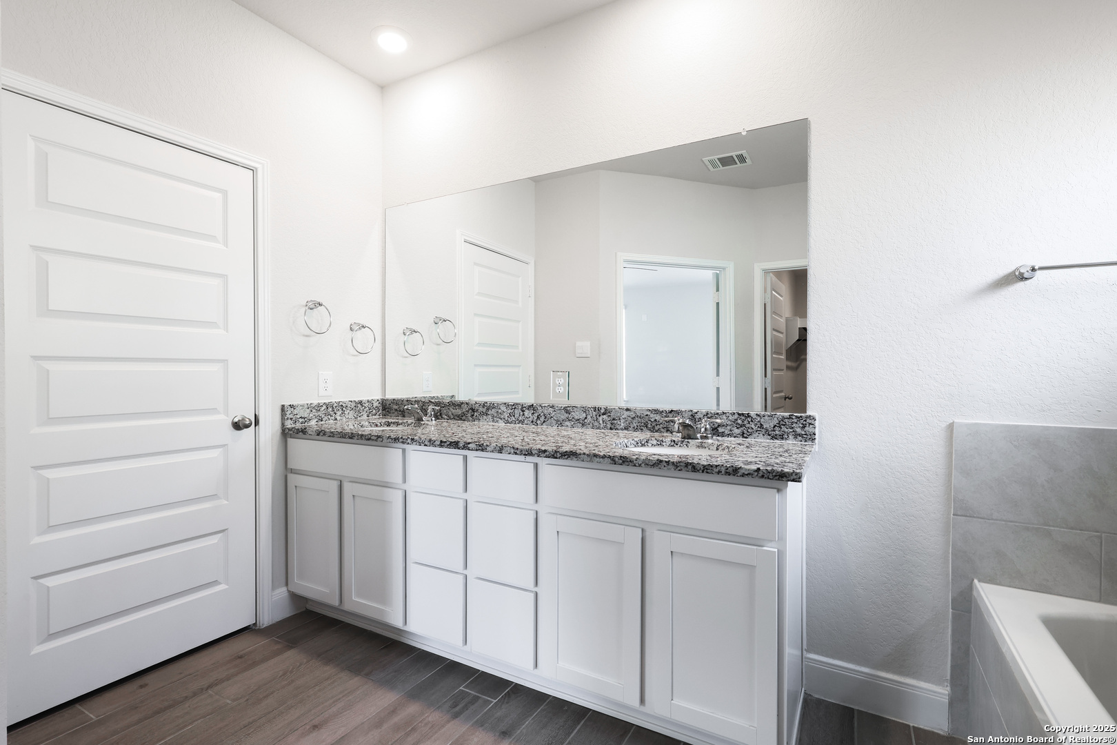 618 Bronze Streme Cibolo, TX 78108 - Photo 15 of 27 a bathroom with a granite countertop sink and a mirror