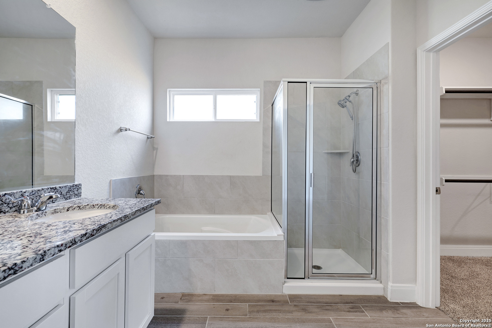 618 Bronze Streme Cibolo, TX 78108 - Photo 16 of 27 a bathroom with a granite countertop sink mirror and bathtub
