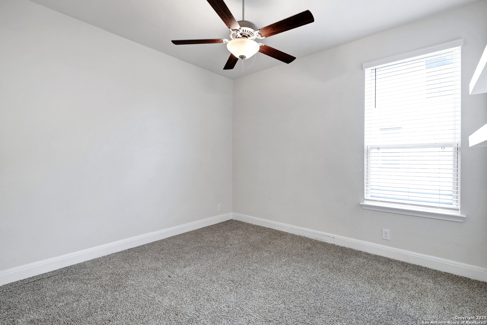 618 Bronze Streme Cibolo, TX 78108 - Photo 18 of 27 an empty room with a window and a fan