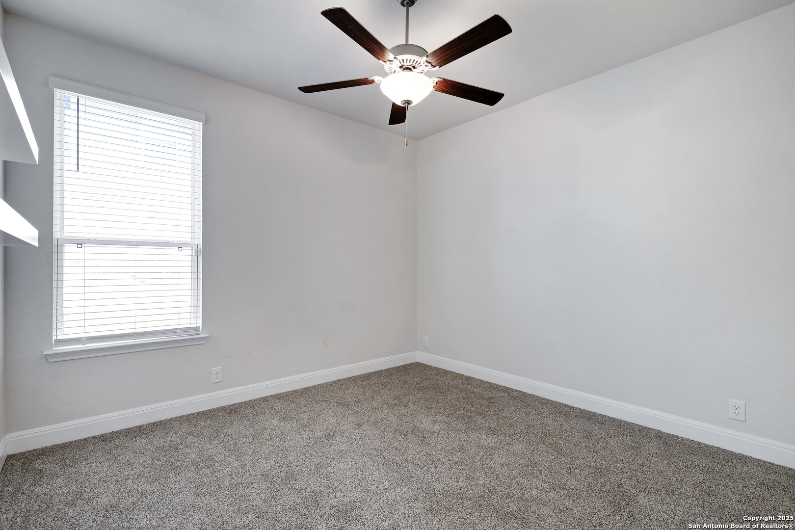 618 Bronze Streme Cibolo, TX 78108 - Photo 20 of 27 an empty room with a window and a fan