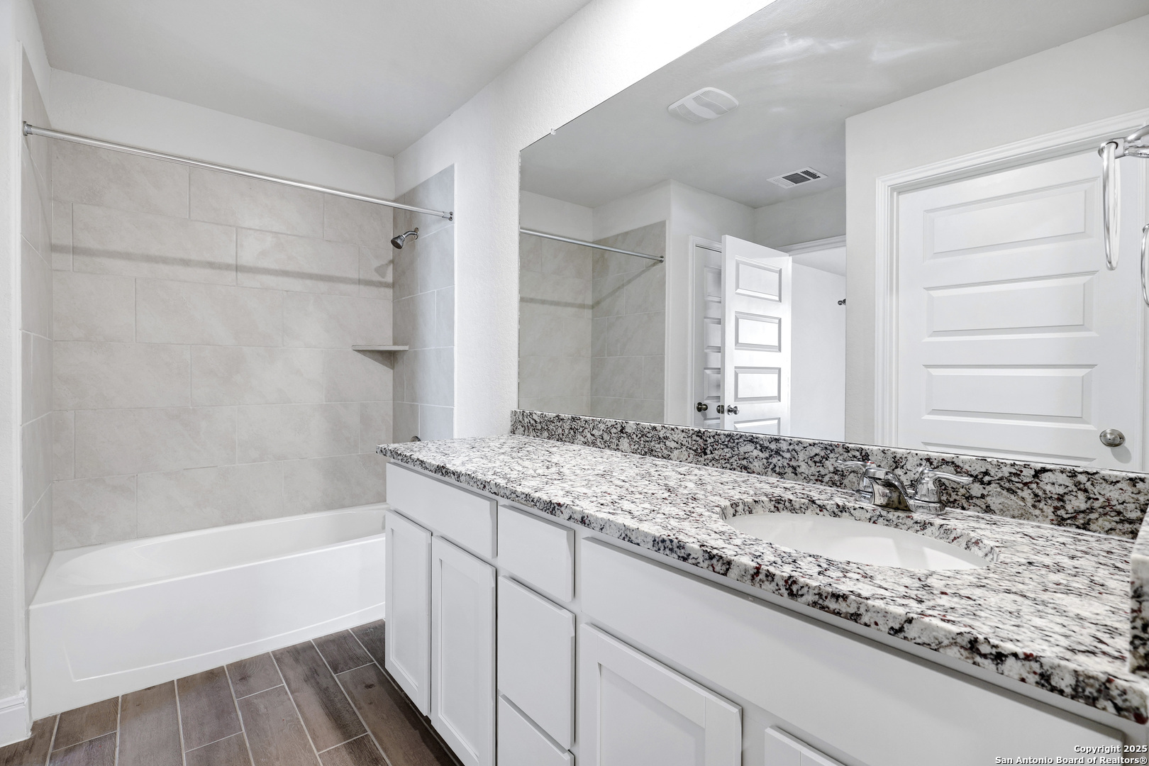 618 Bronze Streme Cibolo, TX 78108 - Photo 24 of 27 a bathroom with a granite countertop sink and a bathtub