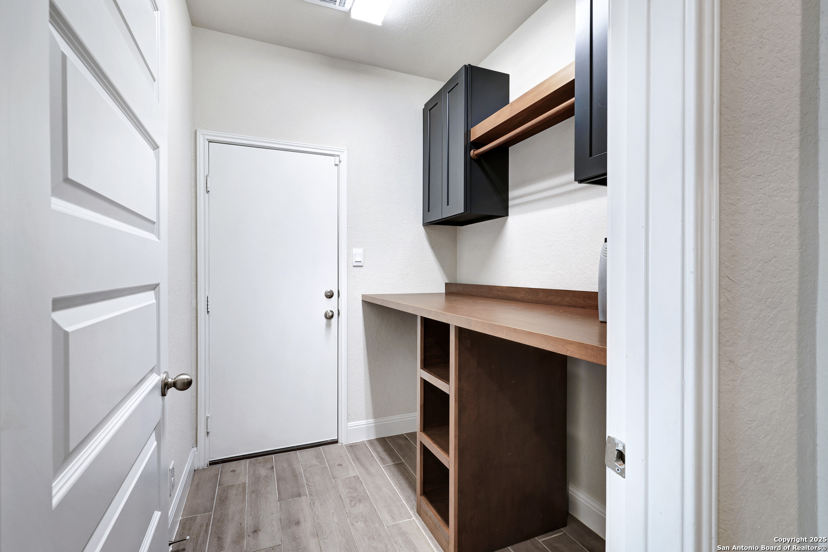 618 Bronze Streme Cibolo, TX 78108 - Photo 25 of 27 a view of hallway with stairs and wooden floor