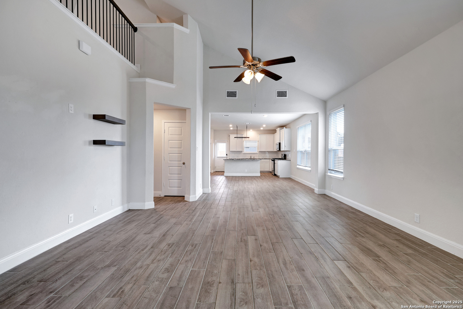 618 Bronze Streme Cibolo, TX 78108 - Photo 4 of 27 a view of a livingroom with wooden floor a ceiling fan and windows