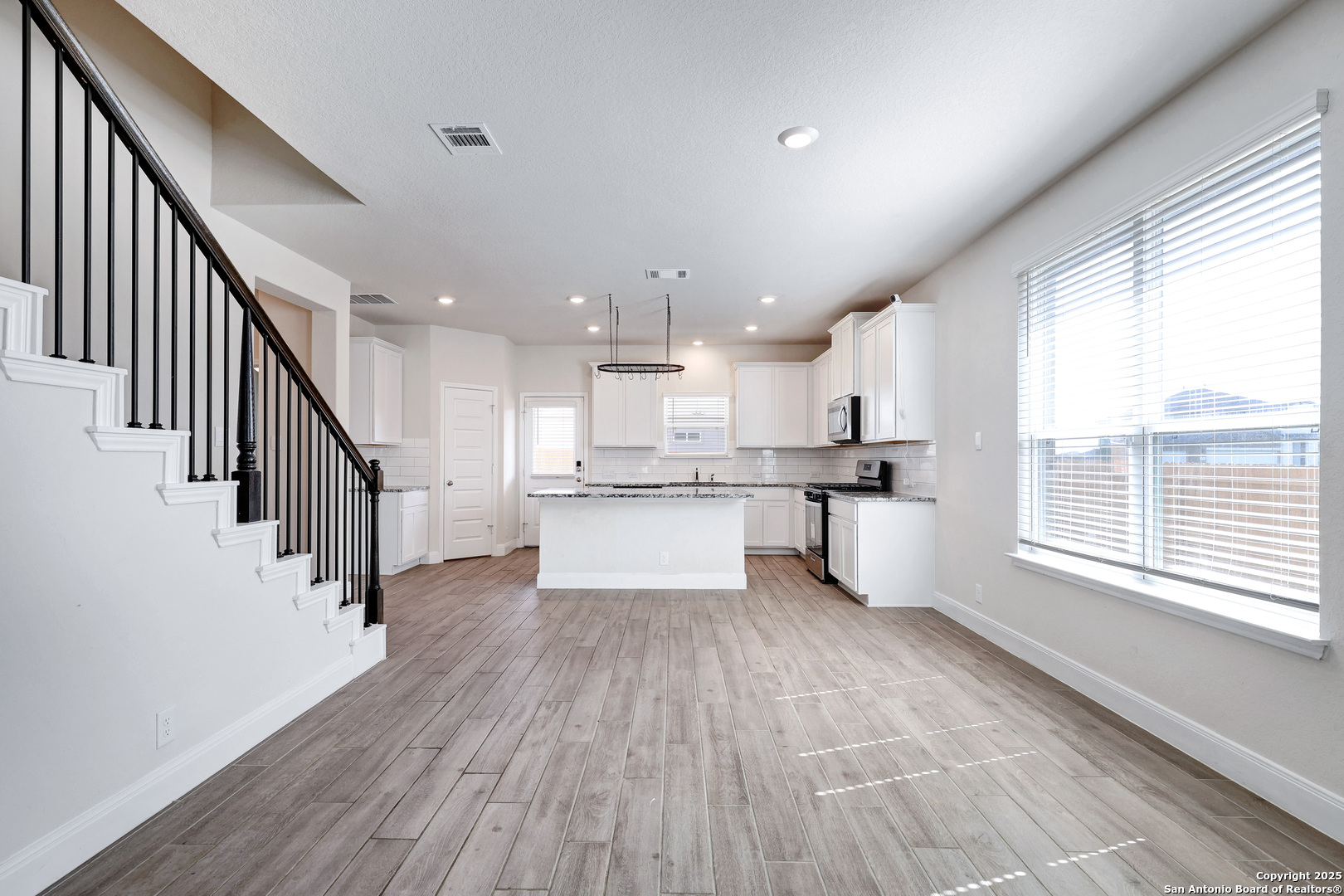 618 Bronze Streme Cibolo, TX 78108 - Photo 7 of 27 a view of kitchen with wooden floor and electronic appliances