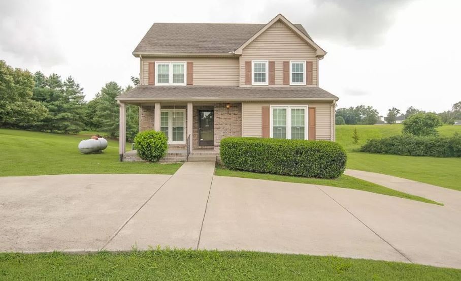 2010 Bradbury Road Adams, TN 37010 - Photo 1 of 1 a view of a yard in front view of a house