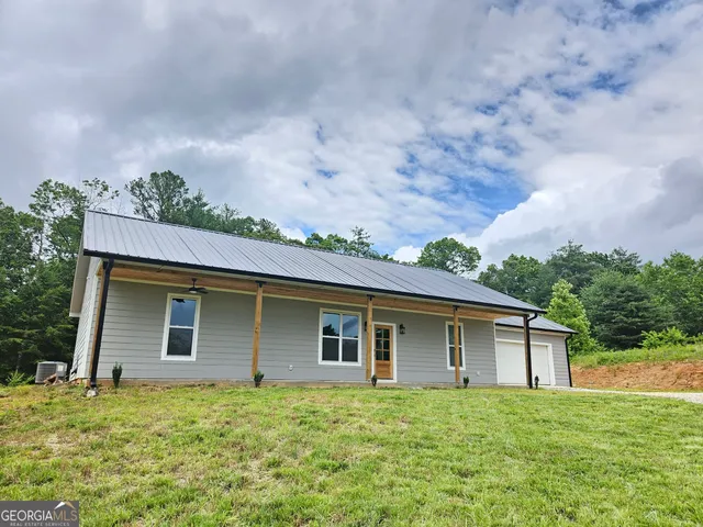 a house view with a garden space