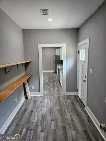 a view of entryway with wooden floor
