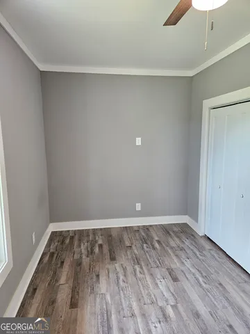 a bedroom with a bed chair and a window
