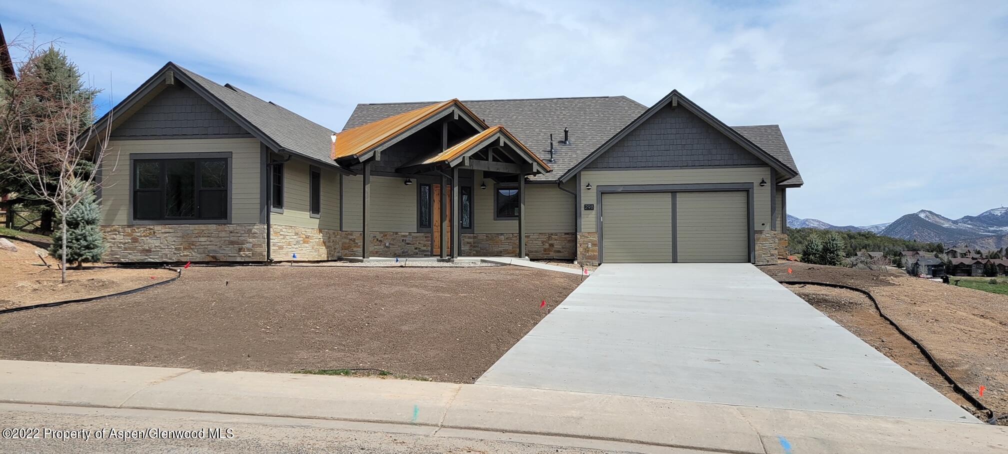298 Blackhawk Drive New Castle, CO 81647 - Photo 1 of 15 a front view of a house with a yard and garage