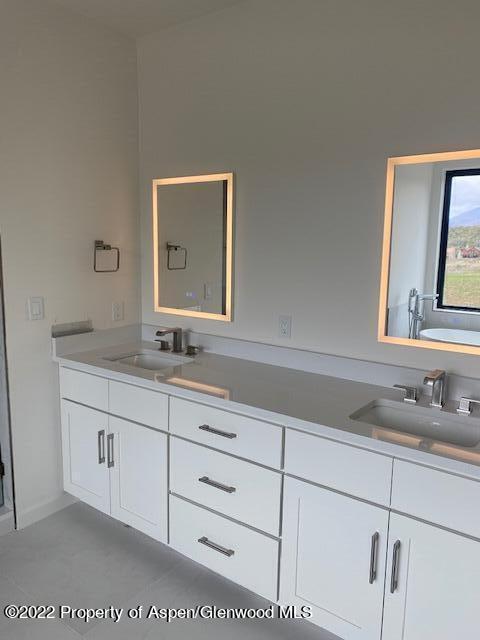 298 Blackhawk Drive New Castle, CO 81647 - Photo 12 of 15 a bathroom with a sink and a mirror