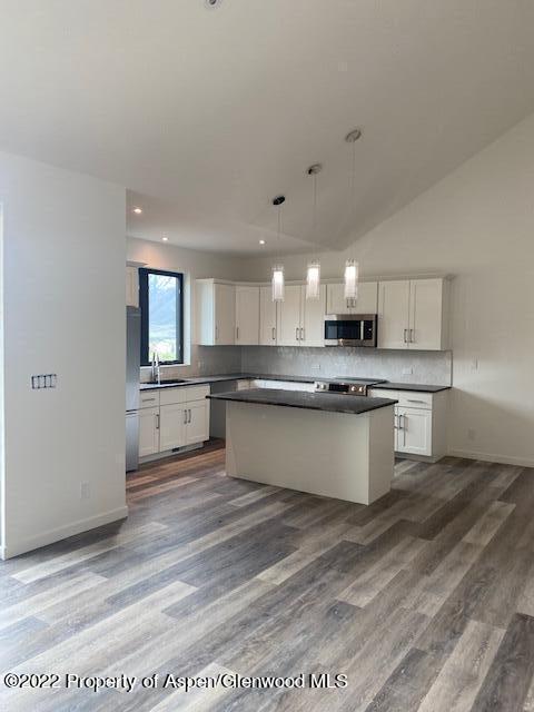 298 Blackhawk Drive New Castle, CO 81647 - Photo 5 of 15 a large kitchen with a center island and stainless steel appliances