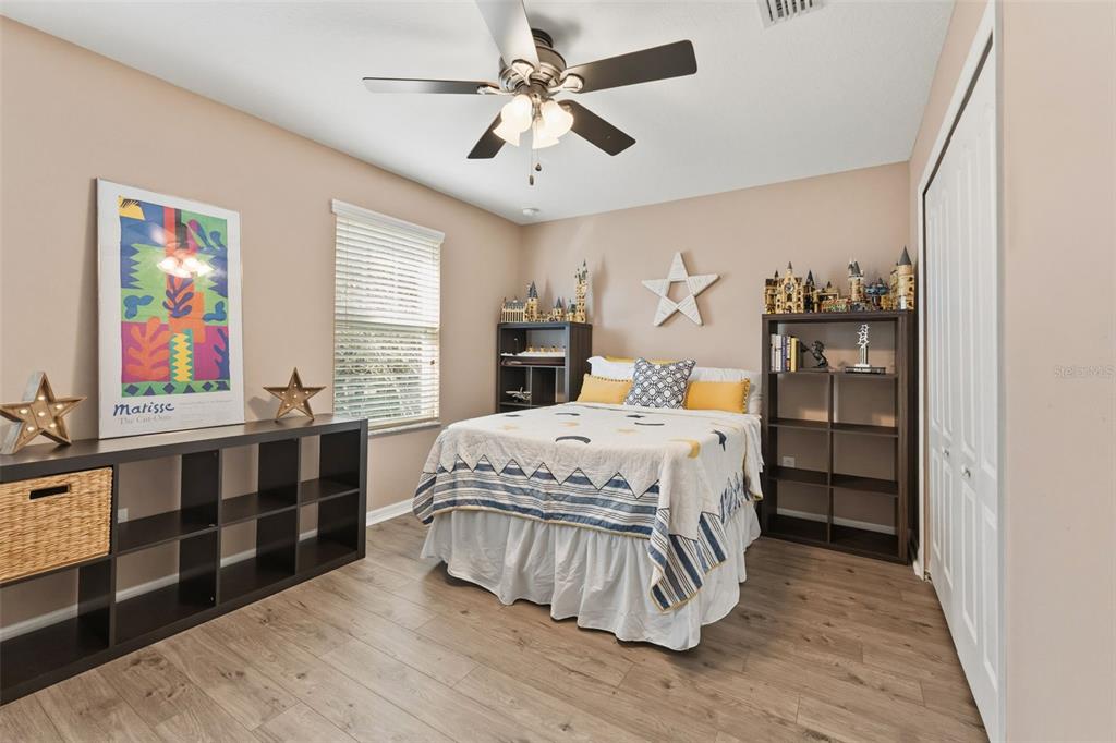 6058 Fishhawk Crossing Boulevard Lithia, FL 33547 - Photo 11 of 47 a bedroom with a large bed and a window